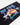 Rip Curl Desto Beach Towel in Black/Blue, angled close-up of Rip Curl lettering and Australian surf graphics.