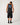 Full-length: Rip Curl Men's Disorder Legacy Tank in Washed Black, full-length rear view styled with black shorts
