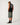 Full-length: Rip Curl Men's Disorder Boneyards Muscle in Black, full-length rear view styled with denim shorts