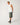 Full-length: Rip Curl Men's Disorder Boneyards Muscle Shirt in Bone, full-length model view styled with denim shorts