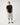 Full-length: Rip Curl Men's Wettie Passage Icon Tee in Black, full-length model view styled with light denim shorts