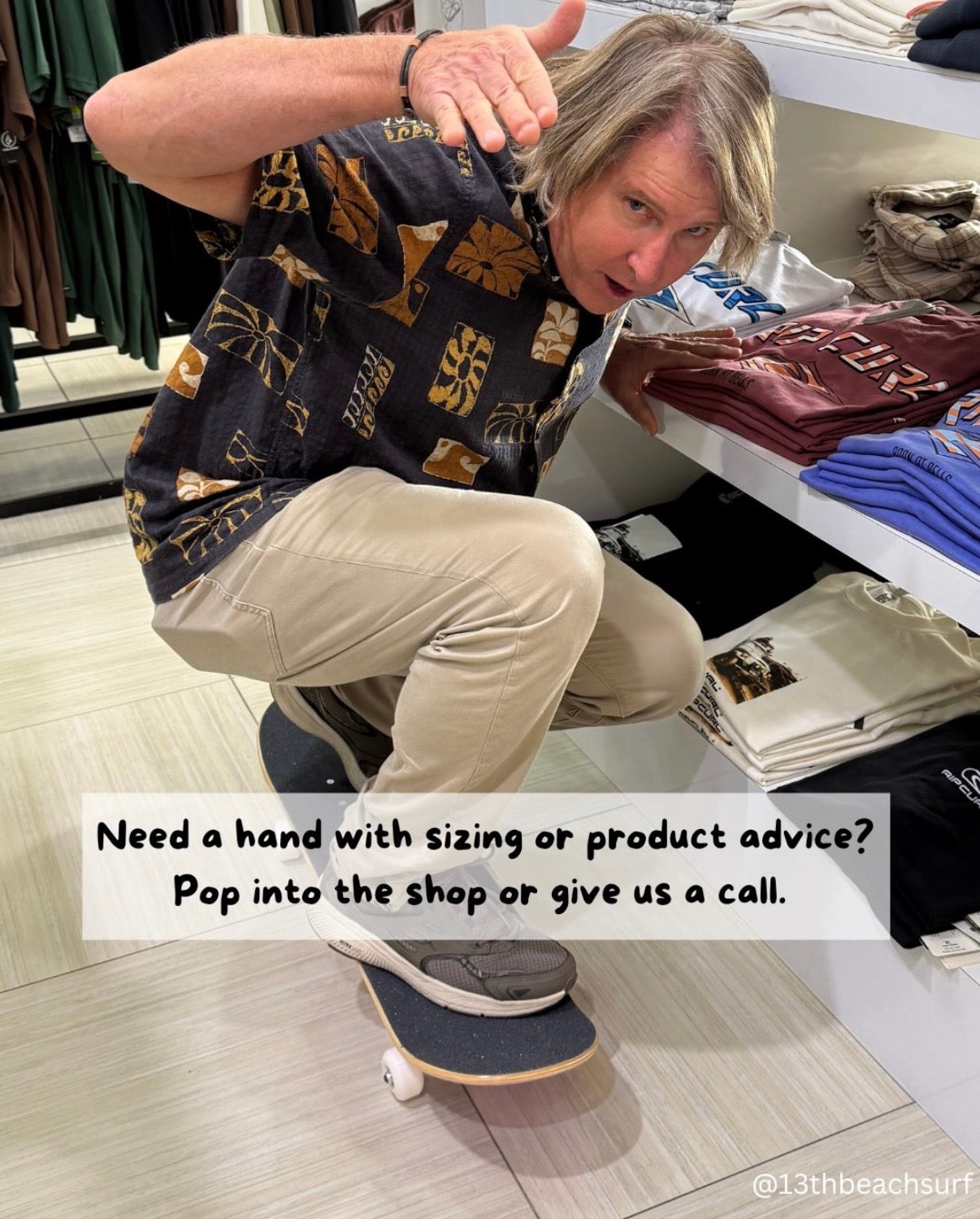 13th Beach Surf team member offering sizing and product advice in store